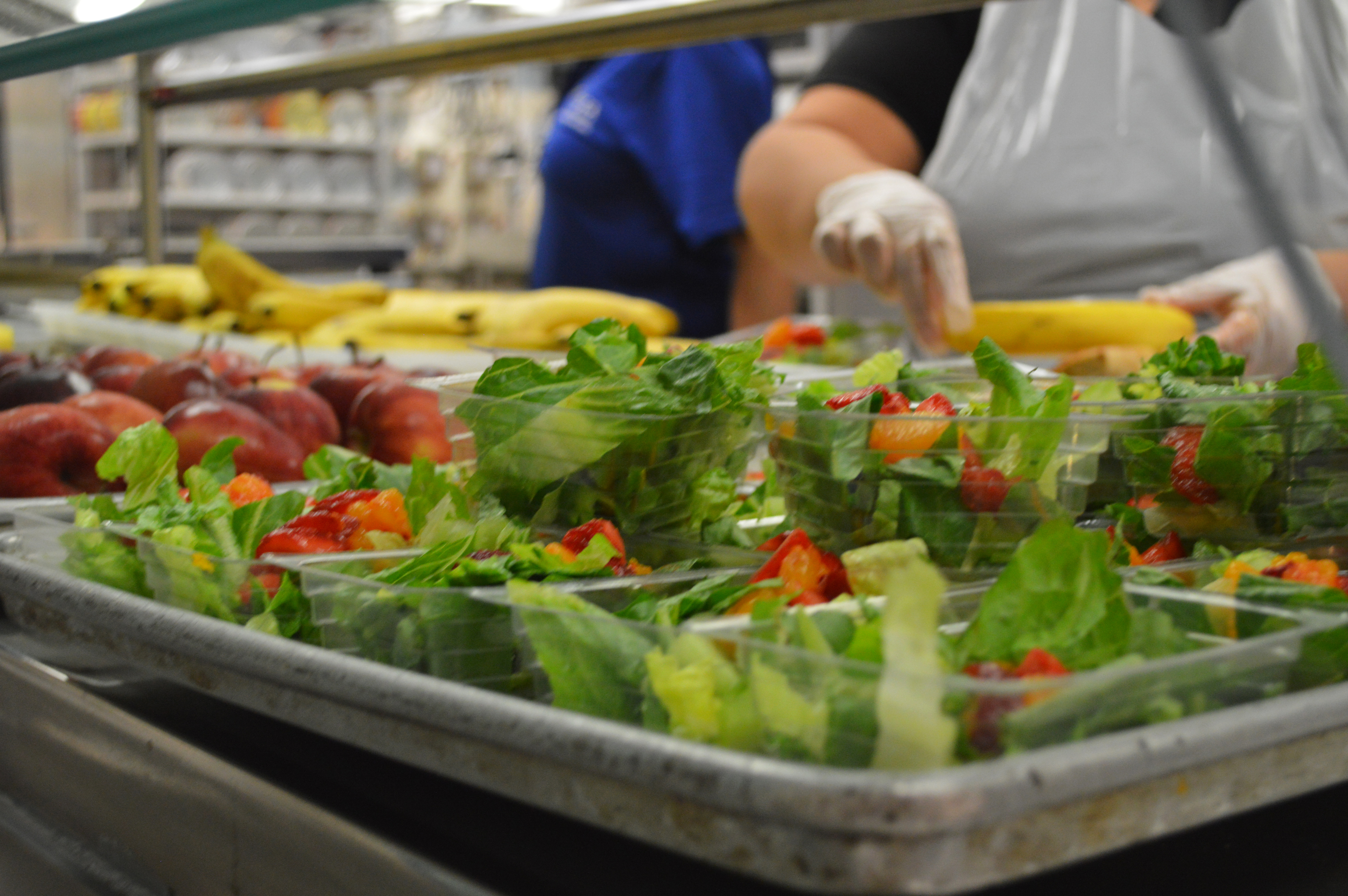 Cafeteria staff at IDEA Public School in Donna, Texas, prepare menu items for lunch. Photo by Charis Dietz, Texas Hunger Initiative