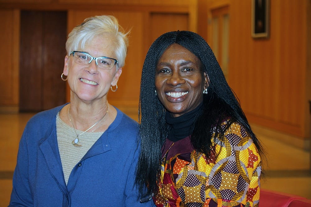 Sara Johnson and Ngozi Iwere standing together after a presentation.