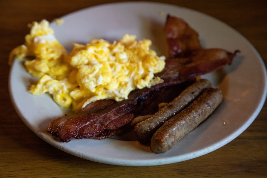 plate with eggs, sausage, and bacon