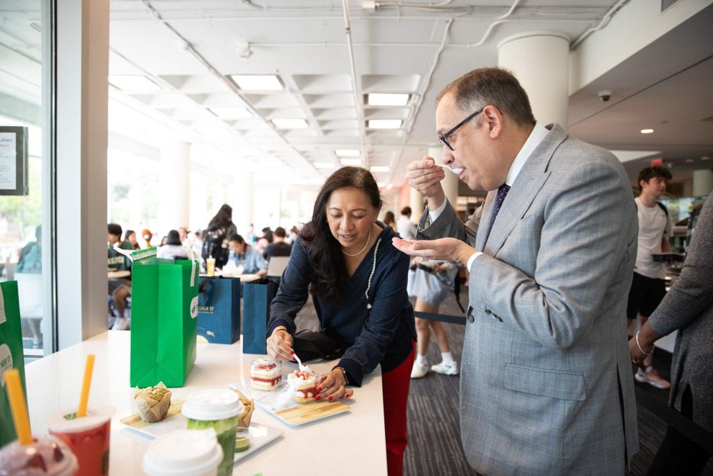 the chancellor and Dr. G tasting a strawberry shortcake