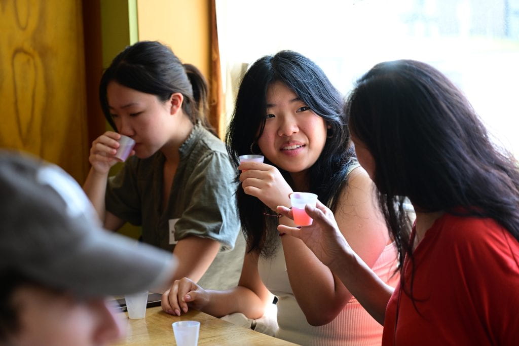 students tasting kombucha