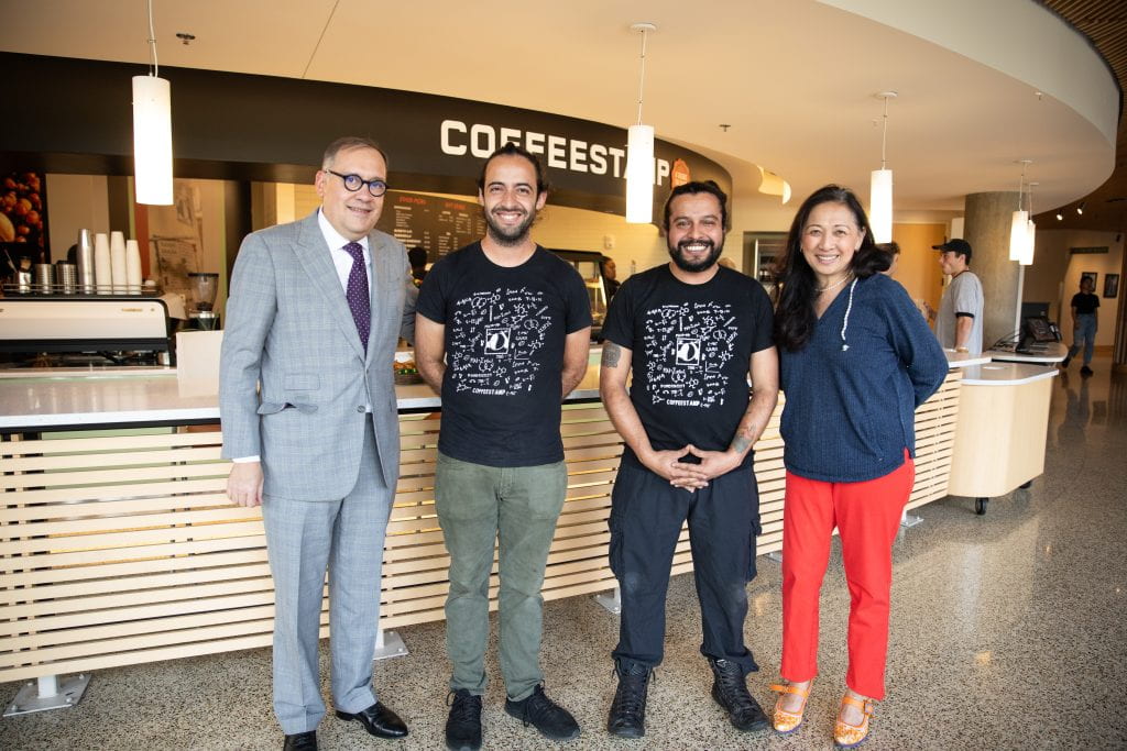 Dr. G and Chancellor Martin posing with Coffeestamp owners and brothers Patrick and Spencer Clapp.