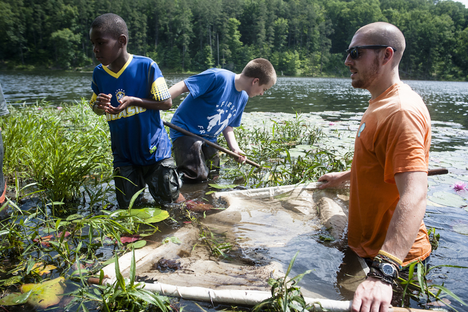 Brien Vincent. 6/18/2014. Rural Action Watershed Restoration AmeriCorps member Rand Romas leads a pond study as part of the KEEN summer camp at Lake Hope State Park near McArthur in Vinton County, Ohio.