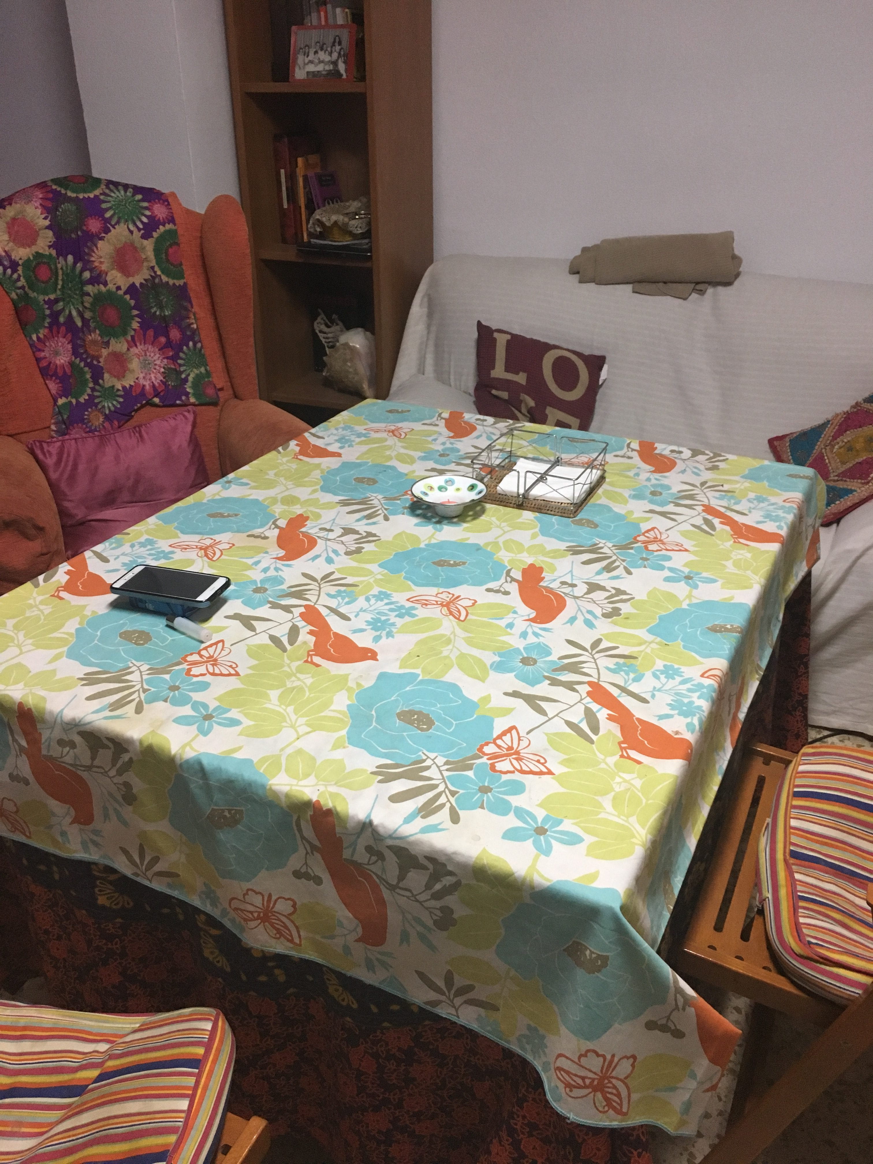 Dining room table with colorful table cloth