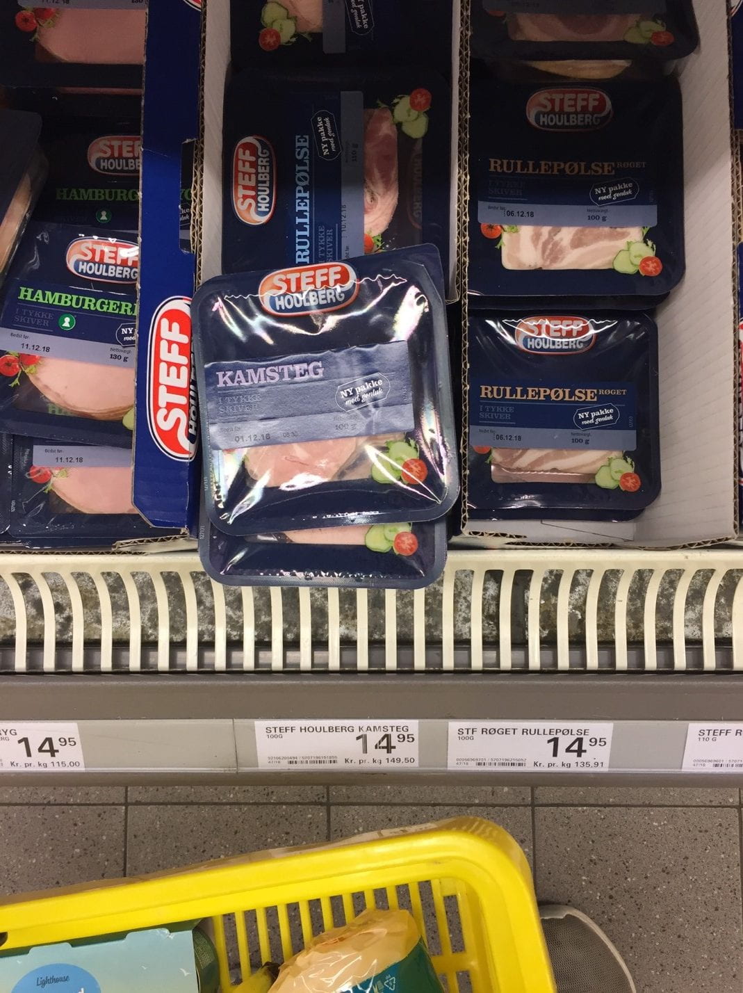 A variety of lunch meat in blue packaging in supermarket in Copenhagen