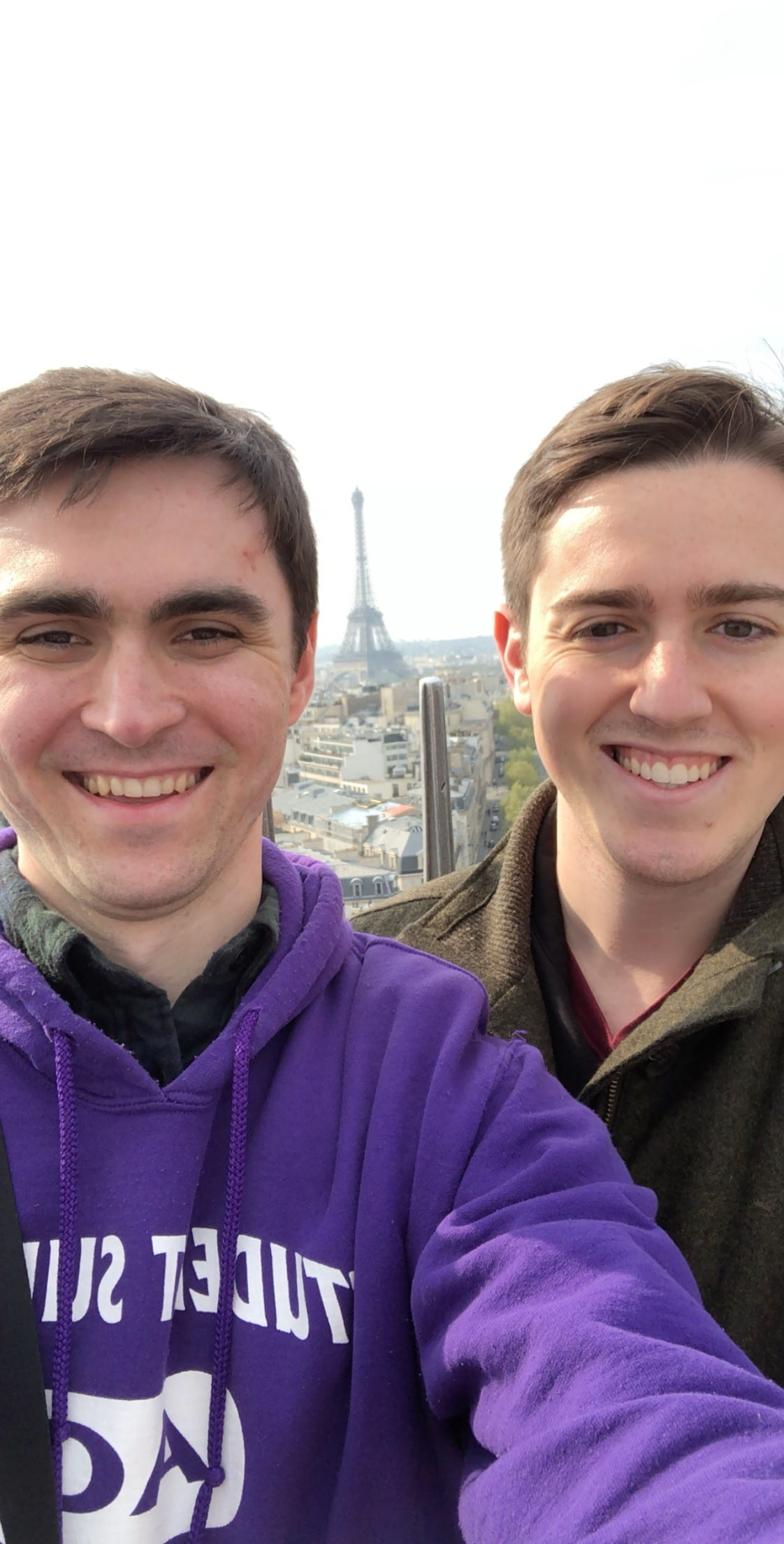 Selfie of Stuart and his partner with Eiffel Tower in the distance 