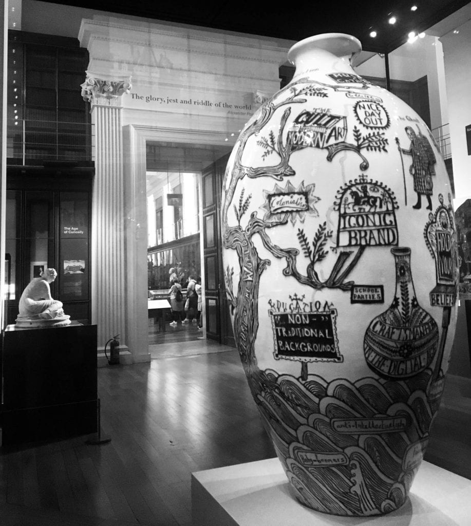 A large vase with various designs on display