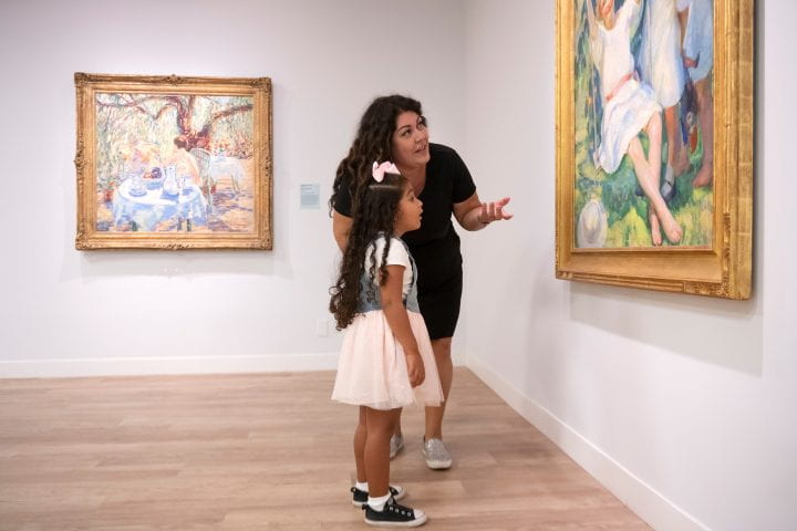 A mother and daughter enjoy the 2024 “Picturing Summer” exhibition